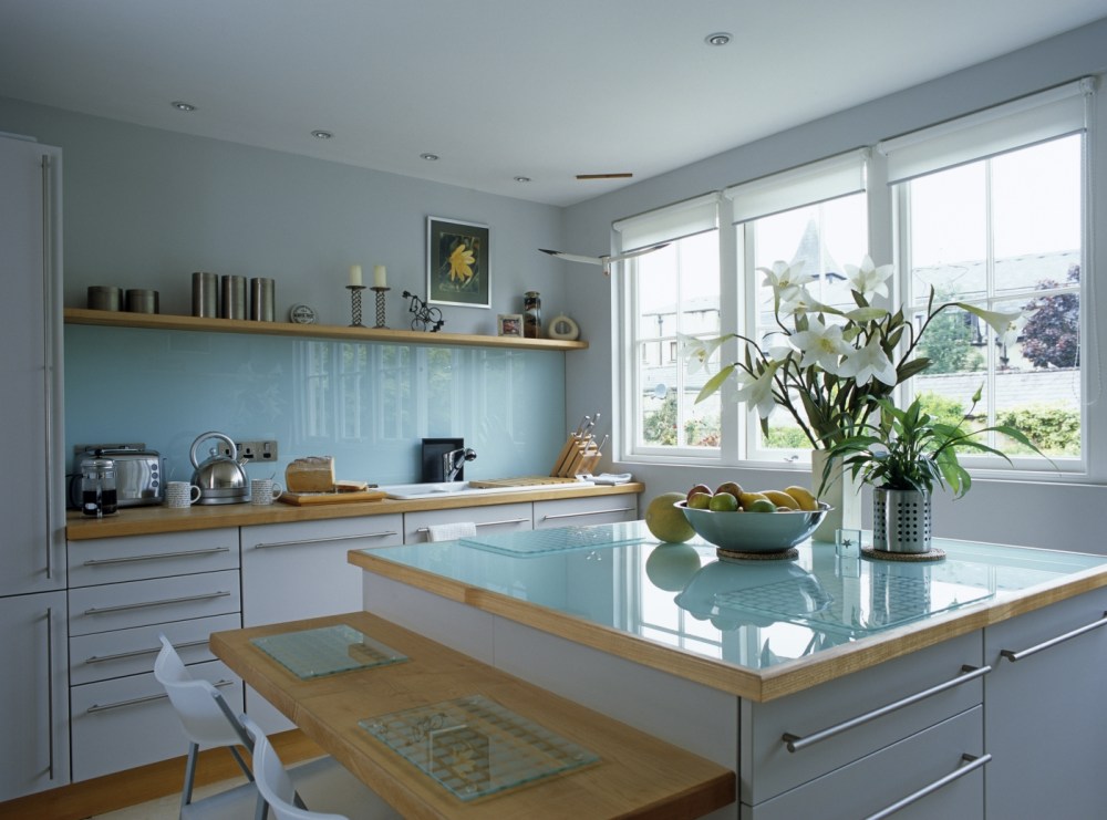 Image: 0029370328, License: Rights managed, Central island unit with blue glass worktop and breakfast bar in kitchen, Property Release: No or not aplicable, Model Release: No or not aplicable, Credit line: ., Red Cover